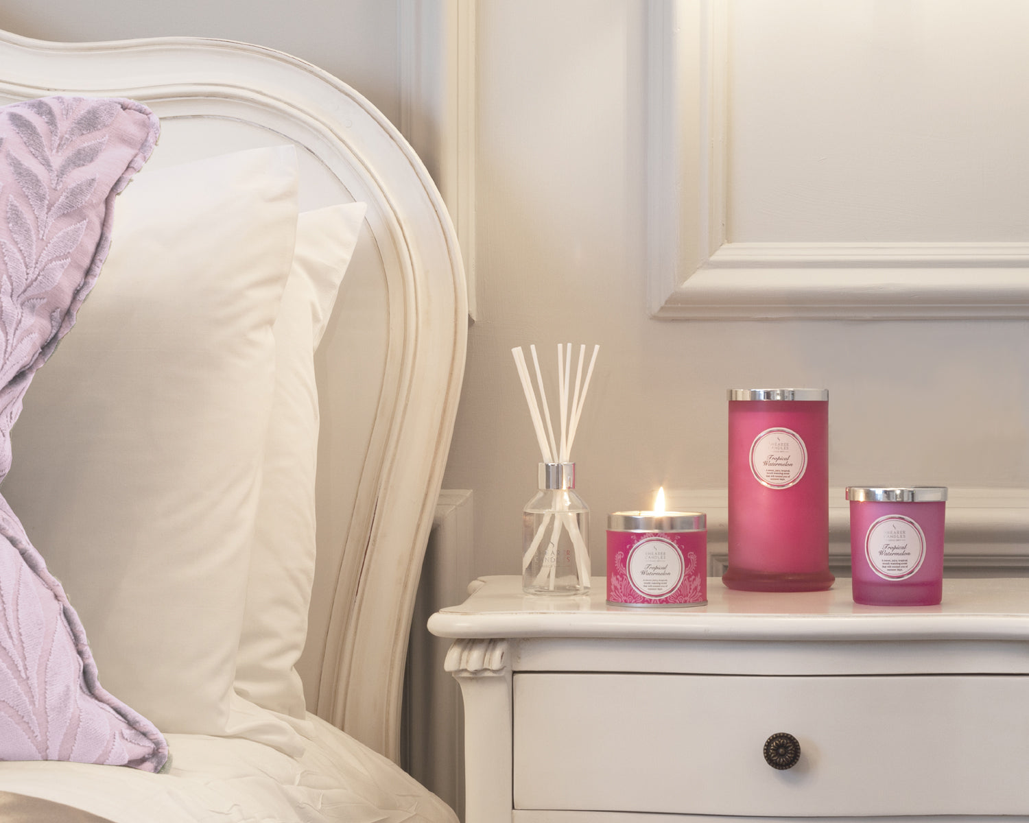 Pink candles at bedside